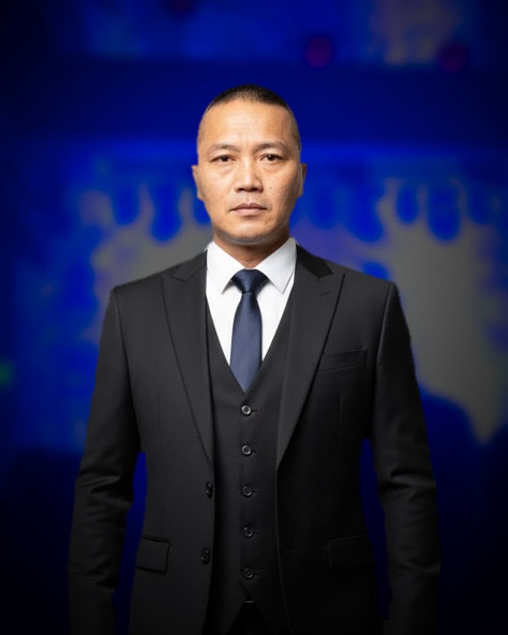 Tuan, Resident Advisor and promoter at Asian Persuasian, standing in a club lit by neon